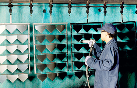 Coating of blades using high-volume conveyor system